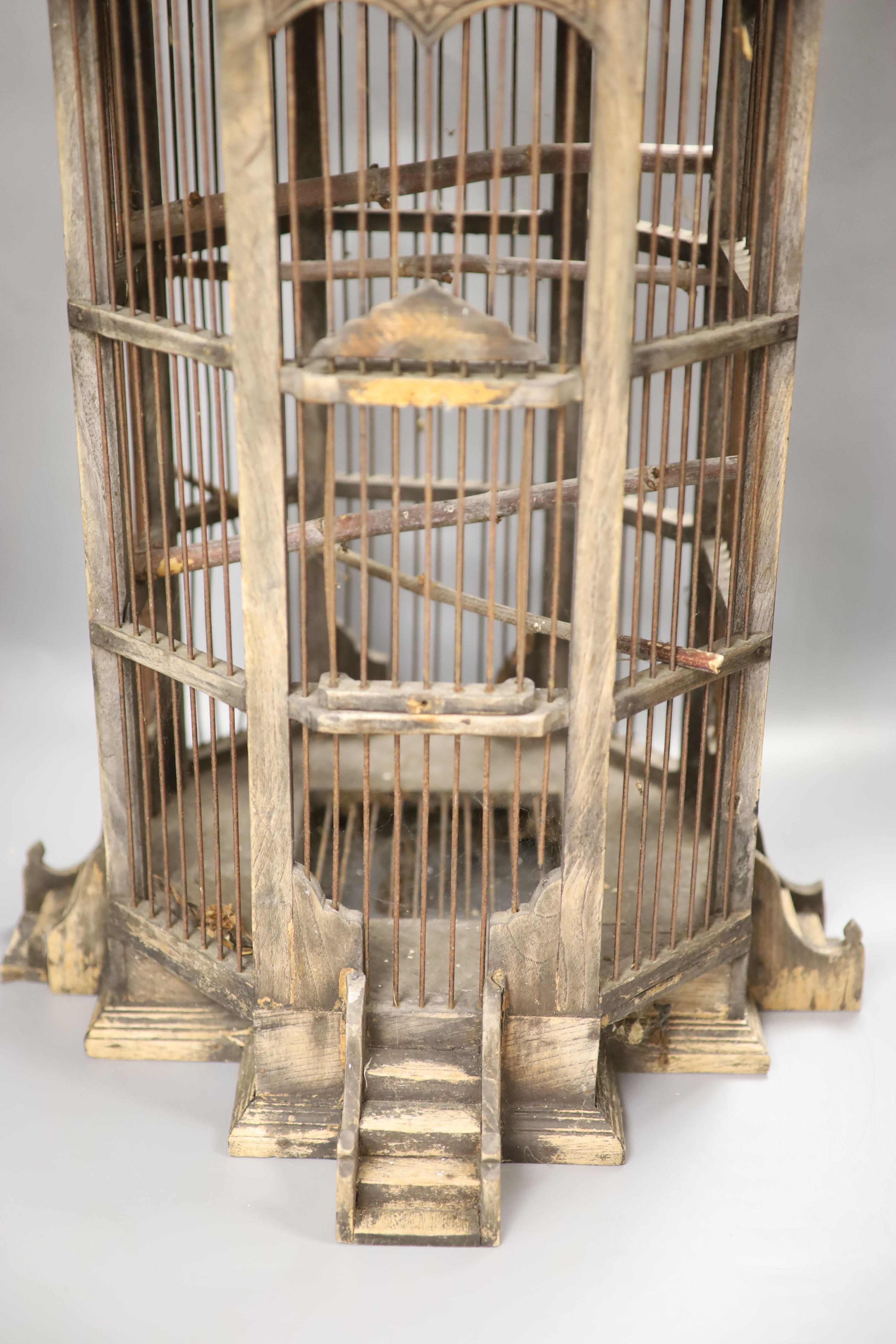 A carved wood birdcage, in Chinese style, height 80cm